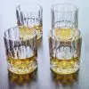 Lot de 4 verres à whisky en cristal sculpté, élégants et raffinés pour une dégustation authentique.